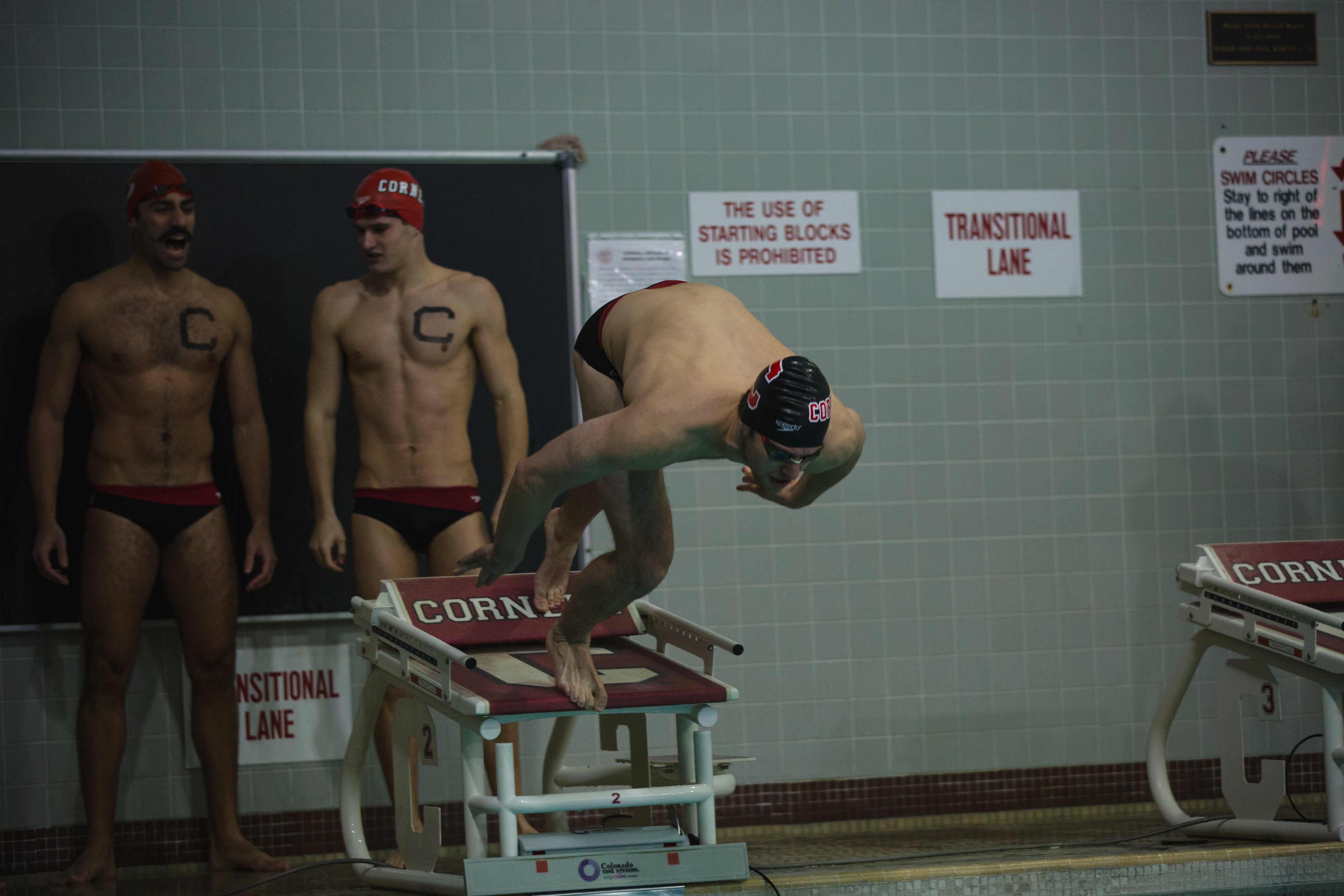 Psyching each other up during our 4x100 free relay during our Harvard/Dartmouth Meet